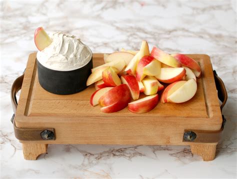 Caramel apple dip with a layer of cream cheese. Fluffy Brown Sugar Apple Dip | Endlessly Inspired