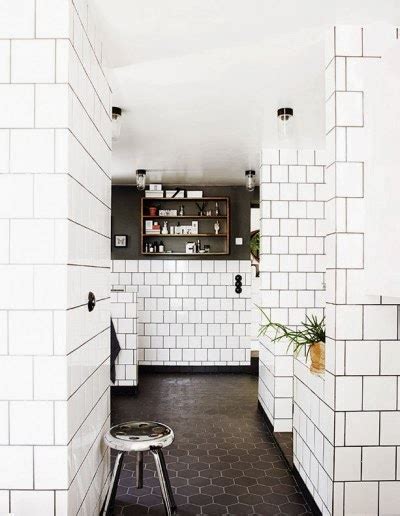 Explore rustic to contemporary bathroom wall tiling designs. To da loos: Bathrooms with white square tiles and dark ...