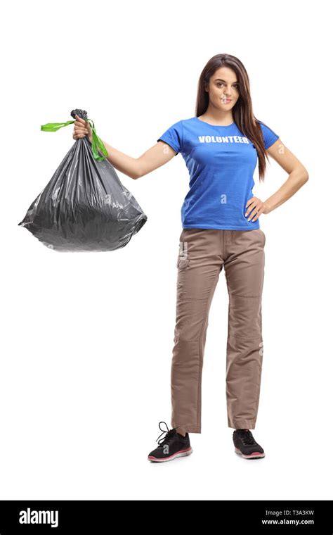 Full Length Portrait Of A Young Female Volunteer Holding A Plastic