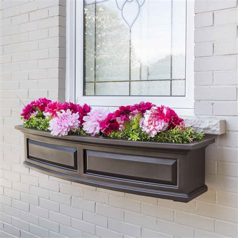 A window box (sometimes called a window flower box or window box planter) is a type of flower container for live flowers or plants in the form of a box attached on or just below the sill of a window. Nantucket 4FT Window Box Planter | USA Exterior