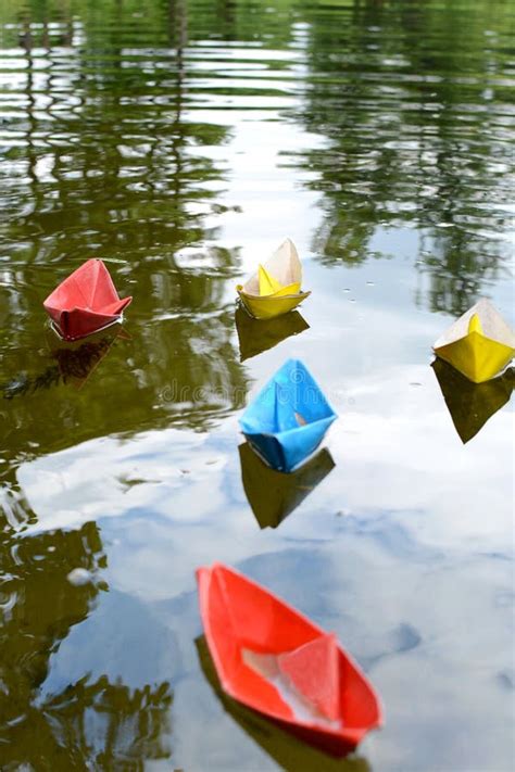 Multicolored Paper Boats Float Down The River Childhood And Dream