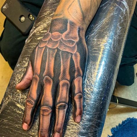 Pin By Evair Hammer On Keanu Reeves Skull Hand Tattoo Bone Hand