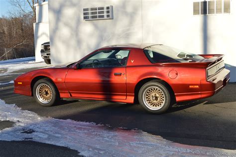 Its a 350 car with a solid roof and cloth interior in the unique color combination of flame red over carmine cloth. 1987 Pontiac Firebird Trans Am GTA for sale #76831 | MCG