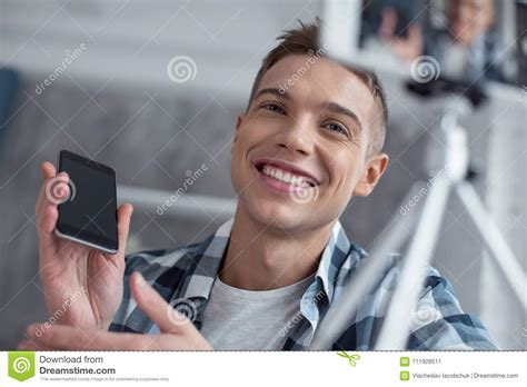 happy blogger talking about his new phone on cam stock image image of activity freelancing