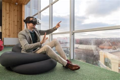 Business Man Wear Digital Glasses Hold Hand Virtual Reality Sit In Front Panoramic Window