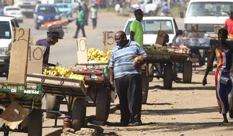 Vendors Selling Fruit From Their Push Carts On The Streets Of Harare
