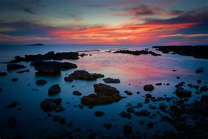 Rocky Shore Sunset During Sea