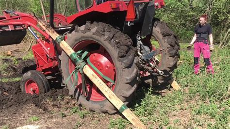 When we tried to pull it out and failed, i left the transmission in neutral and brake off, that is how it. How to get a stuck tractor unstuck - YouTube