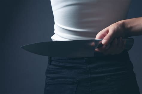 Premium Photo Woman Holding A Knife From Behind