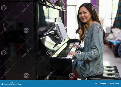 Smiling Chinese Girl Play Classic Piano At Home Stock Image Image Of