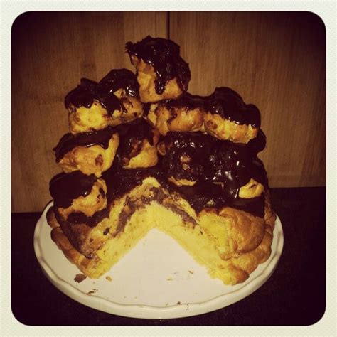Defrost the chocolate sauce sachets that come with the profiteroles and chill until needed. Profiterole cake. Profiteroles filled with custard ...