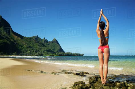 Hawaii Kauai North Shore Tunnels Beach Woman Doing Yoga Stock