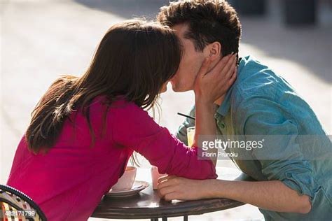couple kissing outside photos and premium high res pictures getty images