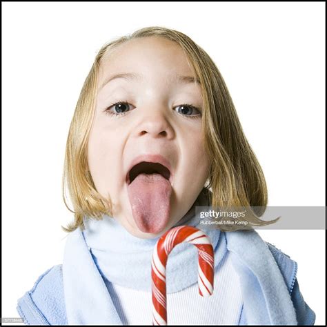 Portrait Of A Girl Sticking Her Tongue Out High Res Stock Photo Getty