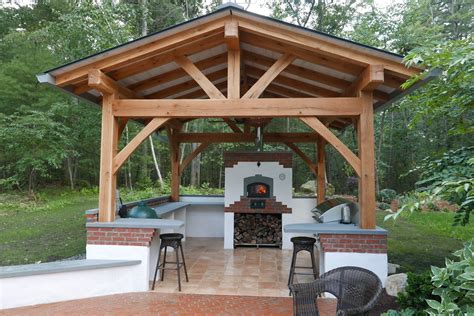 Beautiful Cedar Gazebo With A Gable Roof And Neatly Organized Stone