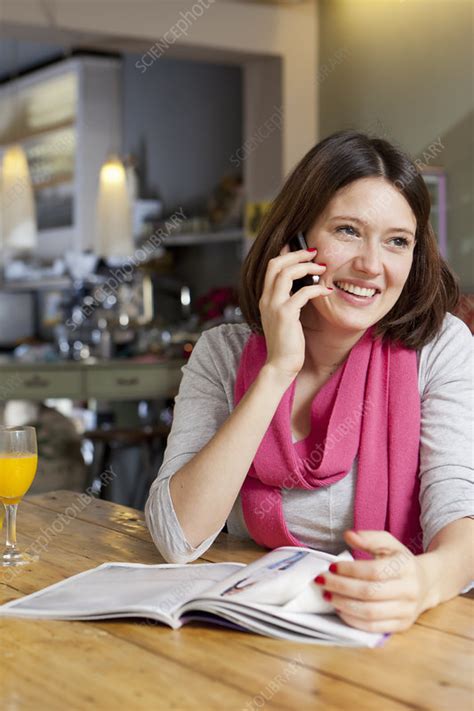Woman Talking On Cell Phone In Cafe Stock Image F005 2291 Science Photo Library