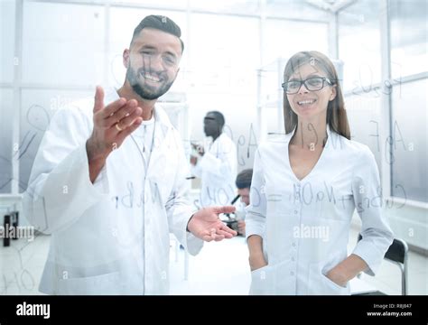 Man And Woman In White Lab Coats Stock Photo Alamy