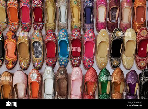 Display Of Colourful Traditional Shoes At A Market Stall India Stock