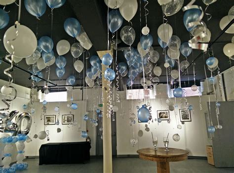 Balloons On The Ceiling With Ribbons Hanging At White Cloth Gallery