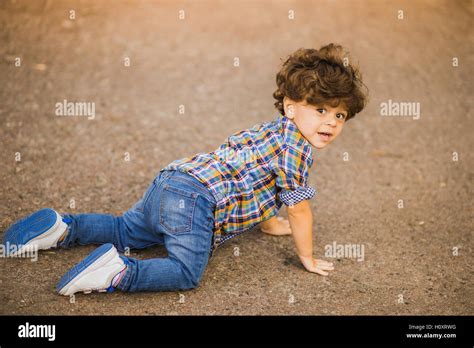 Boy Playing Outdoors Fell To His Knees Stock Photo Alamy