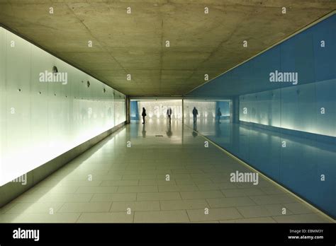 People Walking In A Pedestrian Tunnel Underground City Walkway System