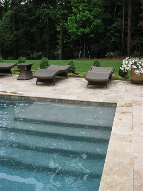 Also some cities won't allow a dark bottom pool. Example of Blue Granite Pebble Sheen, Noce Travertine ...