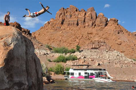 The hike should take approximately 2 hrs to complete. Cliff jumping off the red rocks at Lake Powell, Utah (Good ...