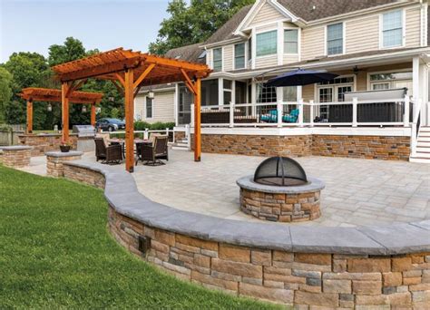 It's easy for homeowners to default to natural tone pavers because they blend well with surroundings. EP Henry patio pavers and wall. Color: Aspen | Patio ...