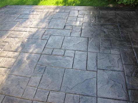 After doing tons of research on stamped concrete designs and colors, we selected the ashlar slate stamp in light grey for our backyard patio. Stamped concrete design for patio. | Collage Oasis ...