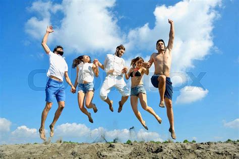 Image Of Young People Jumping Together Outdoor Stock Photo Stock