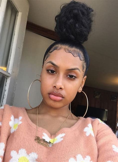 This is how i like to style my afro puff. Baby hair on point @fayrlanabell for more pins ️ | Natural ...
