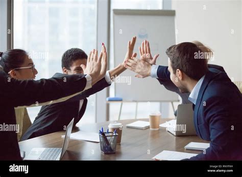 Excited Business Team Give High Five Celebrate Corporate Success Stock