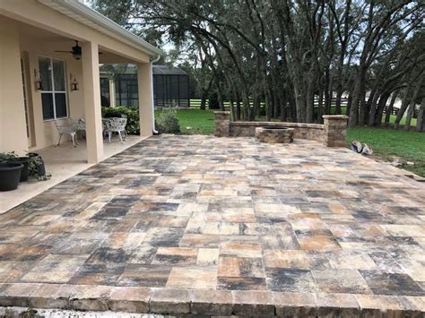 Square concrete paver in a corner, as we did in the photo above, and work out. Square Paver Patio | Father & Son Landscaping, LLC