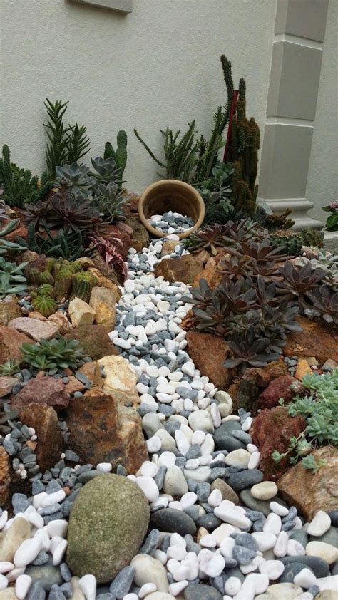 Rock garden designs front yard with flower bed and green grass plus potted plants. rock garden plants #rockgarden | Rock garden design ...