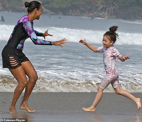 Zoe saldana is supporting shot@life. Zoe Saldana keeps cool by splashing around in Malibu surf ...