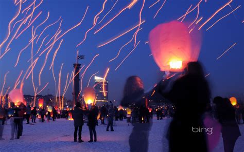 Long Exposure Photograph Of People Launching Paper Lanterns On