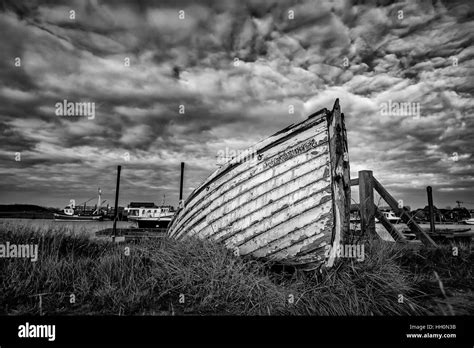 Washed Up Wooden Boat At The Coast Stock Photo Alamy