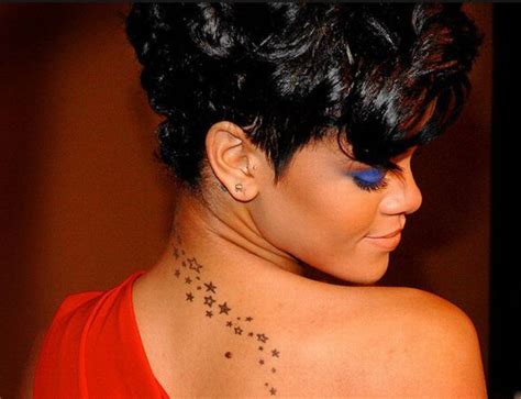 The stars match former boyfriend chris brown's trio of stars behind his ear. Stars falling down her back | Celebrity tattoos, Rihanna ...
