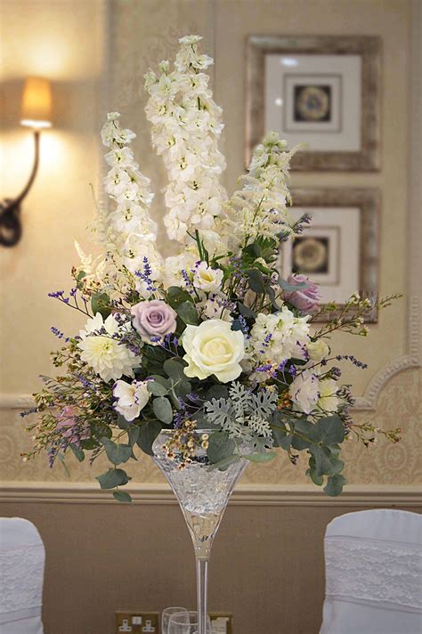 Be inspired by our beautifully designed flower collections, whatever the occasion. Martini cocktail vase of lilac and cream flowers with ...