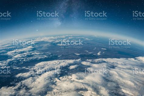 View Of Stars And Milkyway Above Earth From Space Stock Photo