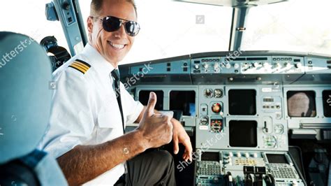 Stock Photo Ready To Flight Rear View Of Confident Male Pilot Showing