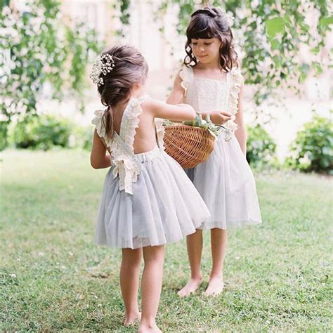 Flower Girls Barefoot In Boho Lavender And White Dresses With Babys