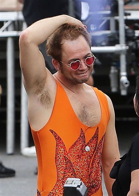 taron egerton pictured as elton john for the first time in new set photos from rocketman biopic