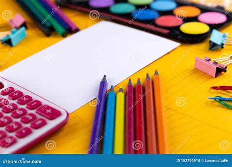 School Office Supplies Stationery On A Orange Paper Background With
