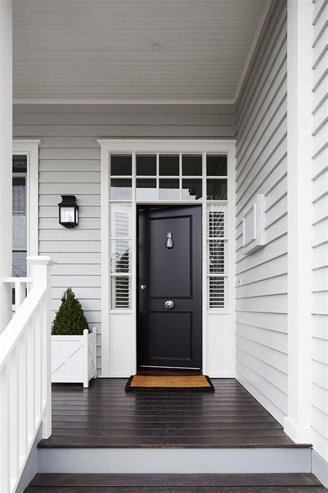 Transform Your Homes Curb Appeal With A Dark Front Door And White Trim