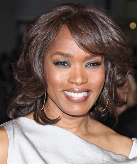 Angela Bassett Medium Wavy Dark Brunette Hairstyle with Side Swept Bangs
