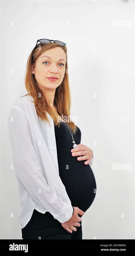 Young Pregnant Woman Holds Her Hands On Her Swollen Belly Love Concept Horizontal With Copy