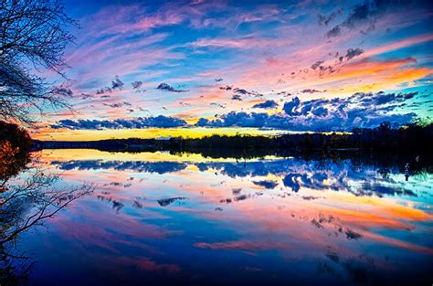 Sunset And Reflection With Beautiful Sky Rainbow Colors Photograph By