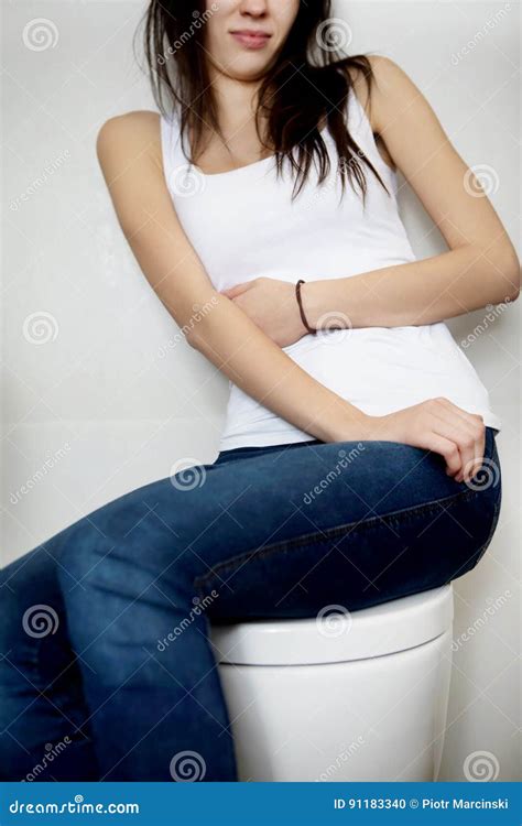Woman Sitting On Toilet Bowl Heaving Belly Ache Stock Photo Image Of