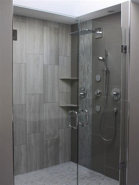 It's not a very good idea to use meter long, gigantic tiles in most small bathrooms because the tile will get cut off a lot; 40 modern gray bathroom tiles ideas and pictures
